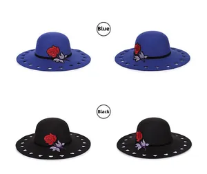 Detail of wool fedora with red rose embroidery and heart-shaped cutout wide brim