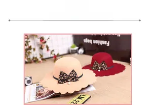 Detail of scalloped edge woolen fedora hat with leopard bow and pearl accent