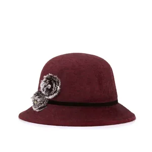 Elegant wine red wool cloche hat for women featuring black fur pom-poms and velvet trim