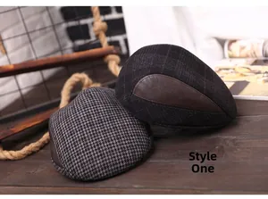 Detailed view of men's vintage newsboy caps featuring grey houndstooth and check wool patterns