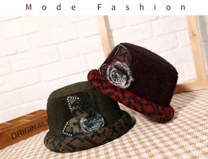Detail of warm winter bucket hats for women featuring houndstooth brims and floral accents
