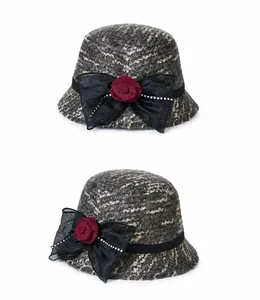 Detailed front and side views of a wool blend bucket hat with rose and crystal bow