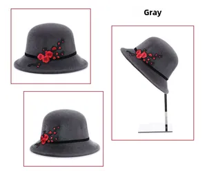 Detail of grey winter cloche hat with black velvet band and elegant plum blossom embroidery