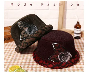 Detail of warm winter bucket hats for women featuring leopard print and plaid textures