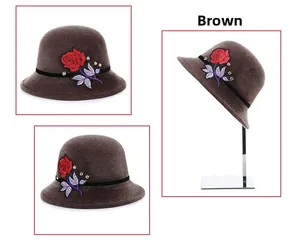 Detail view of brown faux mink fur cloche hat with rose embroidery and rhinestone accents