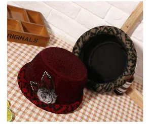 Detail of warm winter hat with rhinestone maple leaf decor and thick fleece lining