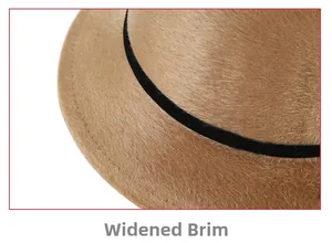 Macro detail of the camel faux fur hat featuring a widened brim and black ribbon trim