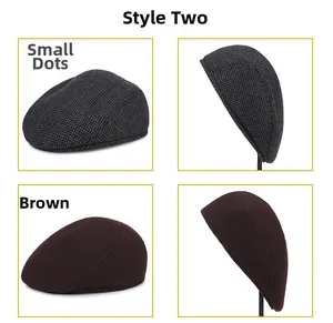 Detail view of winter beret hats in brown and polka dot pattern for older men