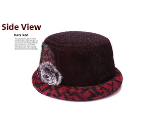 Detail view of winter wine red cloche hat featuring houndstooth brim and floral accent