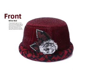 Detailed view of women's burgundy winter fleece bucket hat with plaid brim and bow