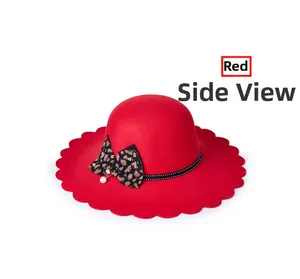 Detailed side view of a red wool felt hat with scalloped edges and a leopard bow with pearl