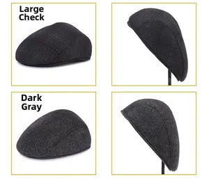 Detailed fabric texture of large check and dark gray herringbone pattern on men's winter hats