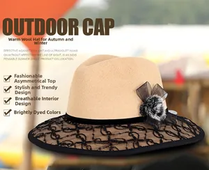 Detail of wool fedora with black lace brim, decorative fur ball, and mesh bow detail