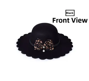 Close-up of black wool felt hat featuring a wavy brim and leopard bow with pearl detail