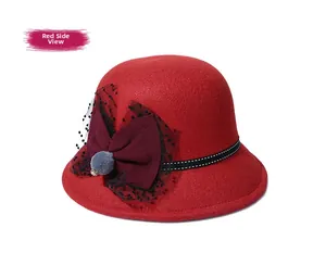 Detail of red wool felt hat with mesh bow and decorative elements for autumn and winter