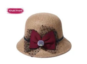 Detailed front view of khaki wool fedora with red bow, black mesh, and crystal accent