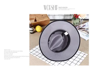 Detail of grey wool fedora hat with black trim on a stylish lifestyle background