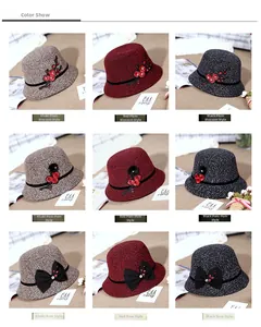 Close-up of winter floral hats in khaki, red, and black with elegant bow and embroidery