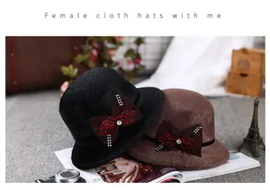 Close-up of elegant women's wool cloche hats with decorative rhinestones and bow accents