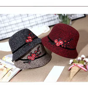 Detailed embroidery with red floral pattern and rhinestones on women's winter wool hats