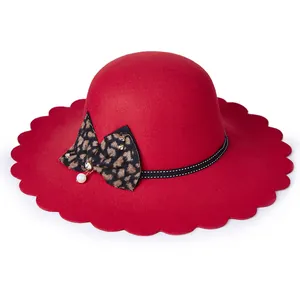 Red wool fedora for women with wavy brim and decorative leopard print bow accent