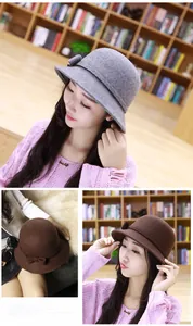 Detail of wool cloche hat showing bow decoration and elegant gray and coffee textures