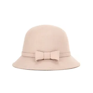 Detailed view of the wool felt bucket hat featuring a delicate bow tie and soft texture