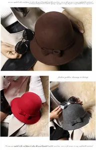 Detail of wool felt cloche hats featuring elegant bow accents in brown, red, and grey tones