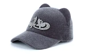 Detail of grey plush cat ear hat with sparkling silver rhinestone butterfly