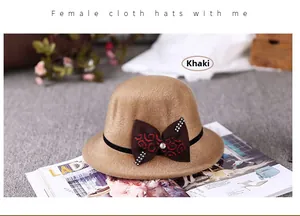 Detail of khaki wool felt cloche hat featuring a rhinestone embellished ribbon bow
