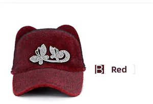 Macro detail of red faux fur equestrian hat with rhinestone butterfly and cute ears