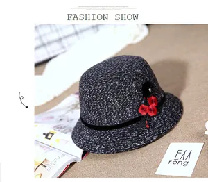 Detail of grey wool blend cloche hat with red flower embroidery and velvet ribbon