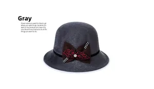 Detail of grey cloche hat featuring wool texture and rhinestones on a side bow