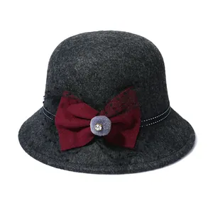 Elegant dark grey wool cloche hat for women with a burgundy bow and mesh veil detail