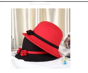 Detail view of stylish wool felt cloche hats for women with floral and bow ribbon accents