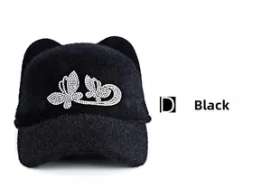 Close-up of black plush winter hat featuring rhinestones butterfly and cat ears