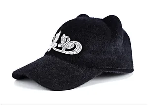 Detailed view of cat-ear baseball cap with sparkling rhinestone butterfly decoration