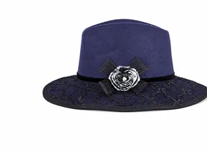 Detail of dark blue wool fedora with lace trim, velvet bow, and faux fur flower accent