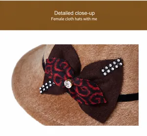 Detail of elegant wool hat featuring a brown leopard bow with sparkling rhinestones
