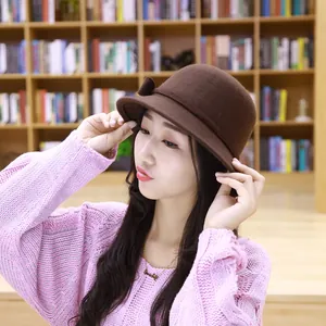 Classic dark brown wool cloche hat for women featuring an elegant side bow accent