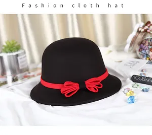 Classic black wool cloche hat for women featuring a stylish red ribbon bow detail