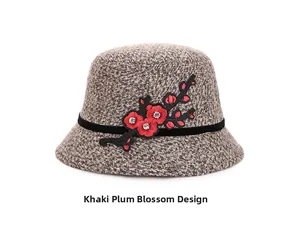 Detail of khaki cloche hat featuring red plum blossom embroidery and rhinestone accents