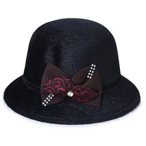 Elegant black faux fur cloche hat for women with a patterned bow and sparkling rhinestones