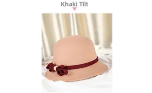 Detail of khaki wool felt cloche hat with a burgundy ribbon bow on a soft background