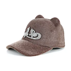 Brown faux fur equestrian hat for women with animal ears and sparkling rhinestone patterns