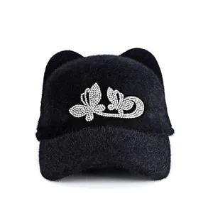 Women's black plush baseball cap with cat ears and rhinestone butterfly accent