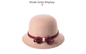 Close-up of khaki wool felt cloche hat featuring a burgundy tricot bow detail