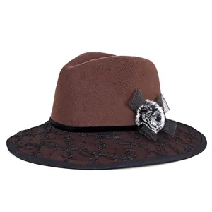 Women's dark brown wool fedora hat with black lace embroidery and fur pompom accent