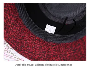 Detail of red-black blend hat featuring anti-slip band and adjustable inner drawstring