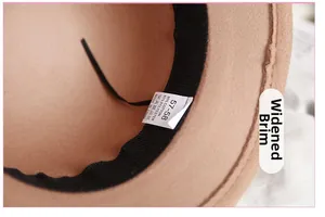 Detail of wool felt hat interior featuring size label and wide brim black sweatband